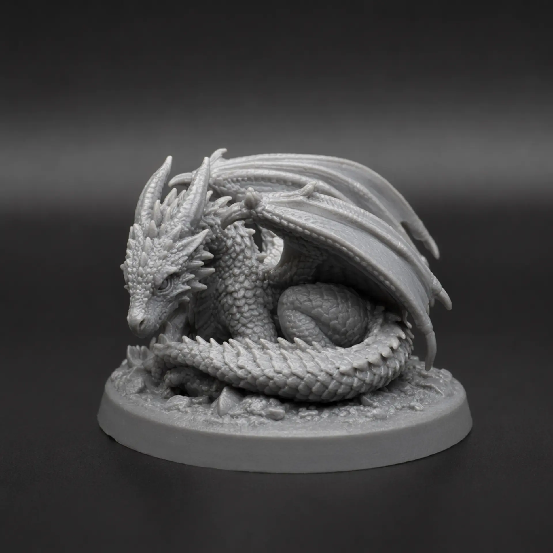 A grey resin tabletop miniature: Dragon